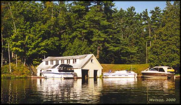 Boats by boathouse at Chaffeys Lock